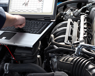 notebook computer being used on car engine